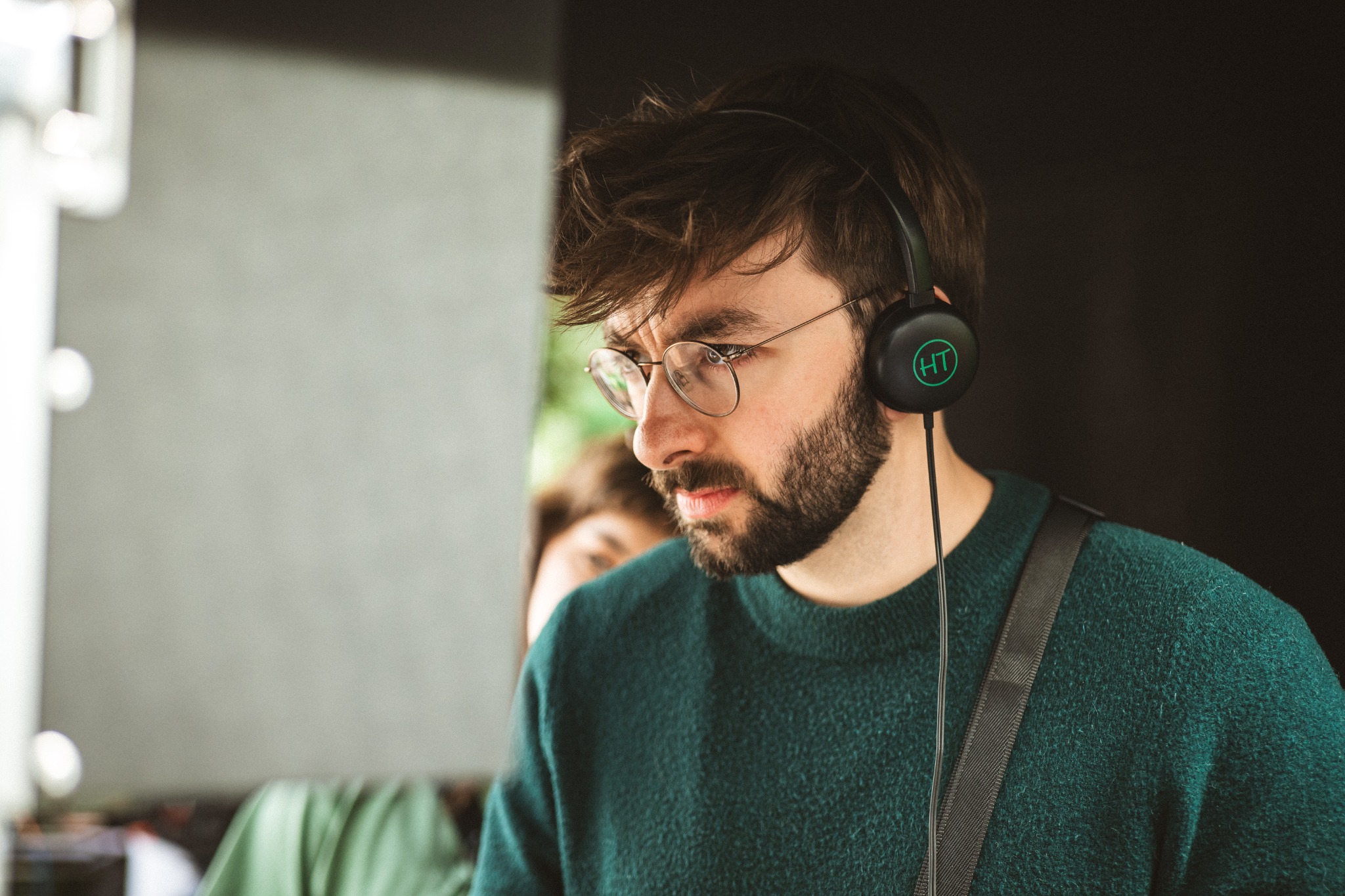 Stijn Van Kerkhoven on set, wearing headphones